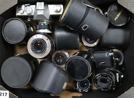 A group of 15SLR camera lenses, a Nikon EM camera etc